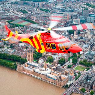 Essex and Herts air ambulance flies over London